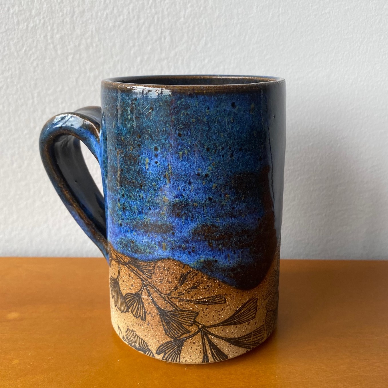 Blue mug with ginkgo leaf pattern